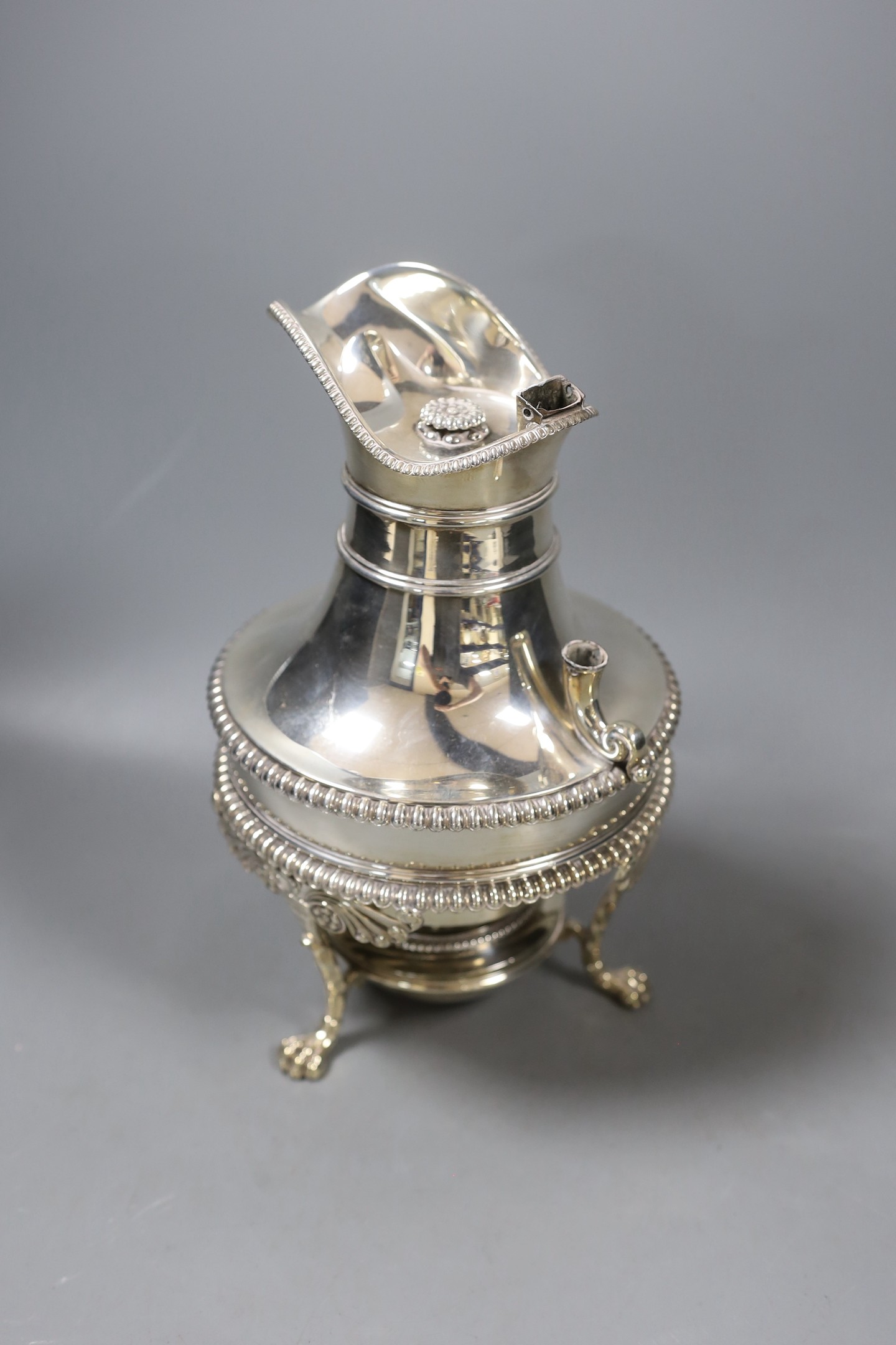 A George III silver hot water/coffee pot, on stand, with burner, George Smith II, London, 1813, lacking handle, overall height 25.3cm